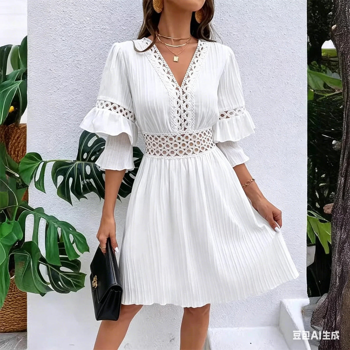 Elegante abito con scollo a V e dettagli traforati in pizzo. Entra nell'estate con stile