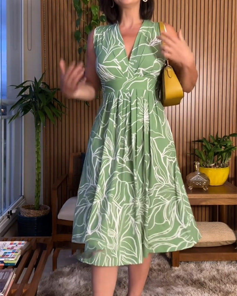 Mouwloze jurk met V-hals en tailleaccent