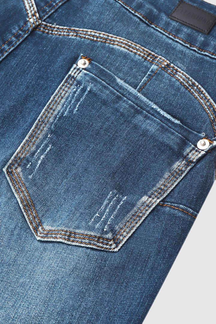 Caprijeans met scheuren en omgeslagen zoom