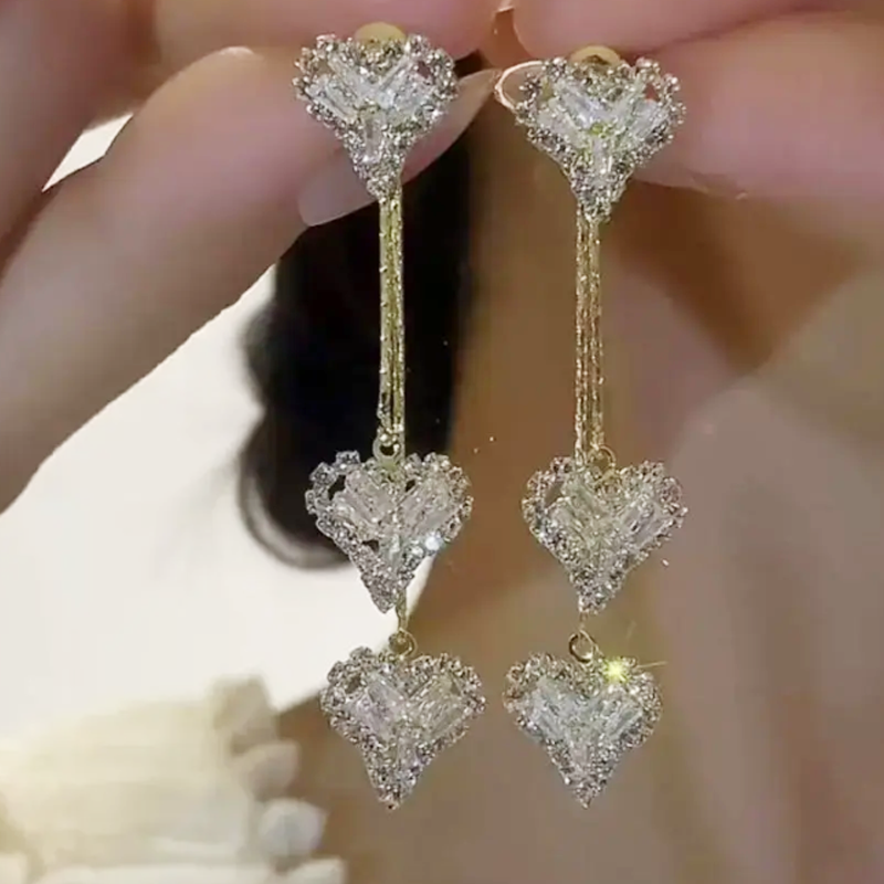 Romantische lange oorhangers met hartje