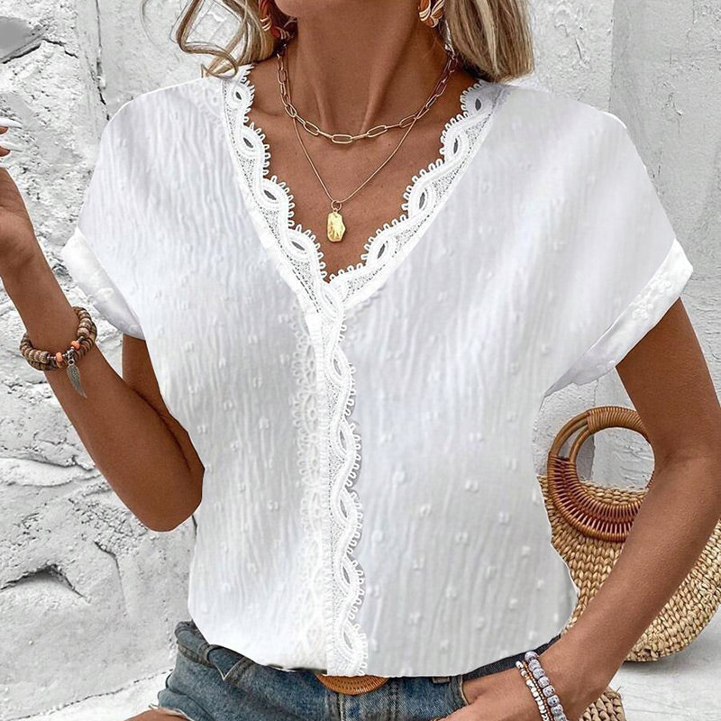 Elegante top bianco in pizzo con scollo a V e maniche corte