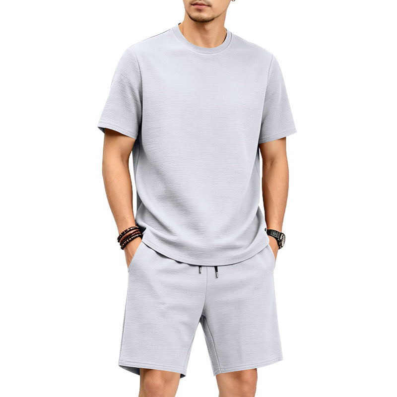 Conjunto de camiseta de cuello redondo de manga corta y color liso para hombre