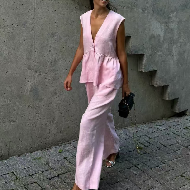 Completo due pezzi tinta unita con top smanicato con scollo a V e pantaloni a gamba larga