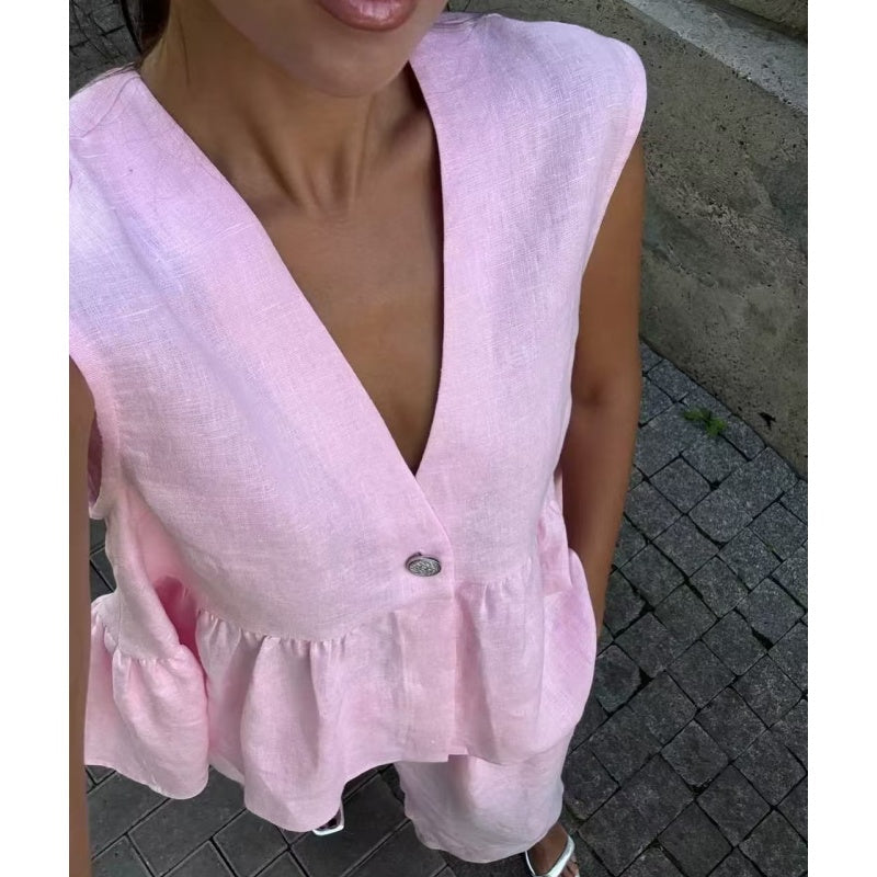 Completo due pezzi tinta unita con top smanicato con scollo a V e pantaloni a gamba larga