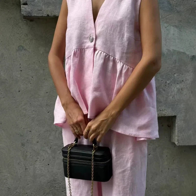 Completo due pezzi tinta unita con top smanicato con scollo a V e pantaloni a gamba larga