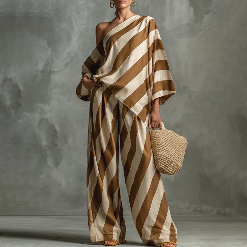Completo da donna con top a righe asimmetriche e pantaloni a gamba larga