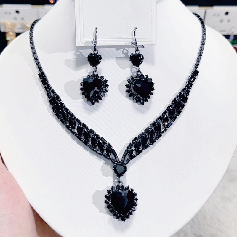 Sprankelende set met hartjesketting en oorbellen