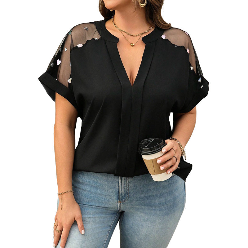 Damesblouse met grotere maat, transparant mesh en V-hals